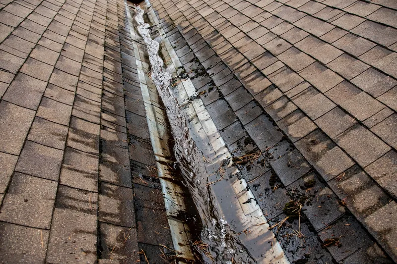 Close-up of a roof valley on an Owasso home where flashing failure causes leaks